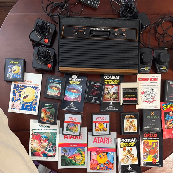 Vintage Authentic Atari 2600 with controllers games and instruction booklets.